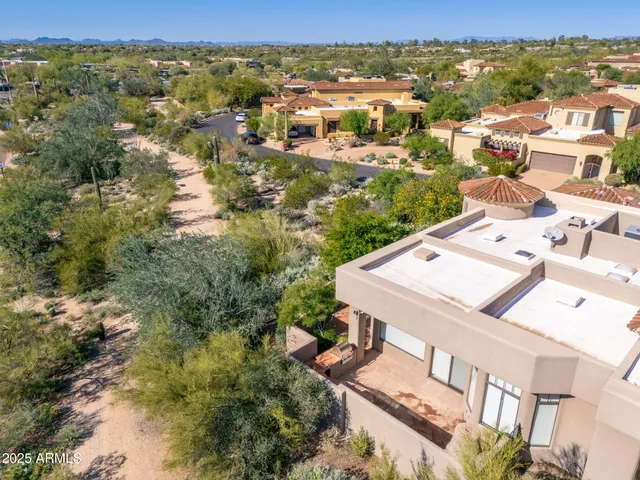 an aerial view of a city with lots of residential buildings