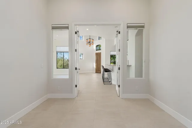 an empty room with a fireplace and window