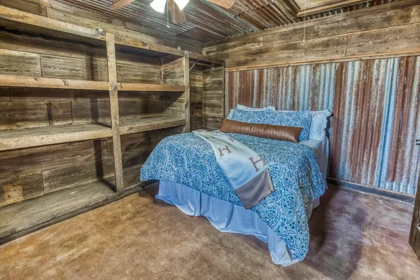 a bed room with a bed and a window