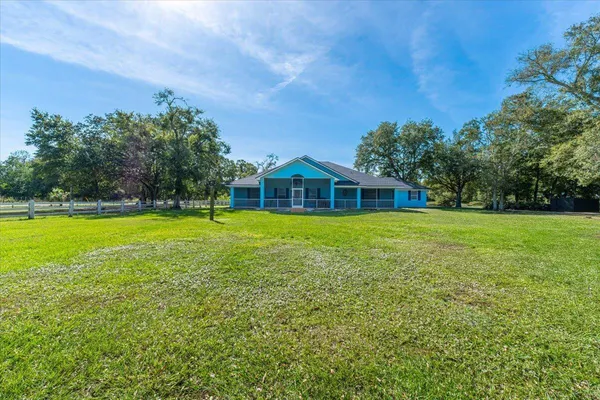 a view of a house with a yard