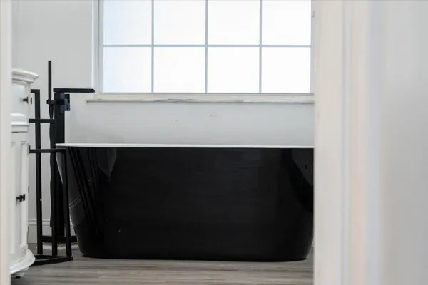 a bathroom with a sink a bathtub and a shower