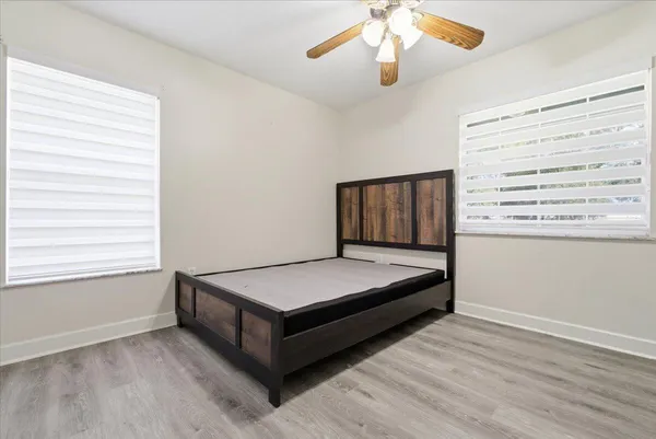 a living room with a bed furniture and a window