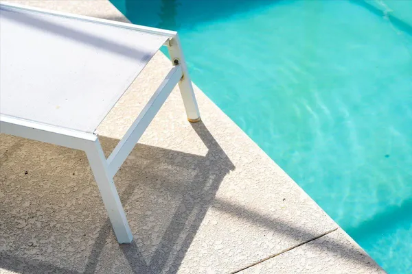 a view of a chairs and table on the deck