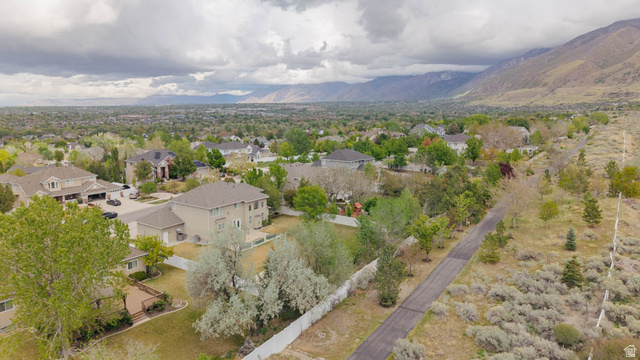 598 Hollow Creek Road Draper, UT 84020 - Photo 7 of 110 Expansive residential landscape featuring multiple properties, mature trees, and mountainous terrain