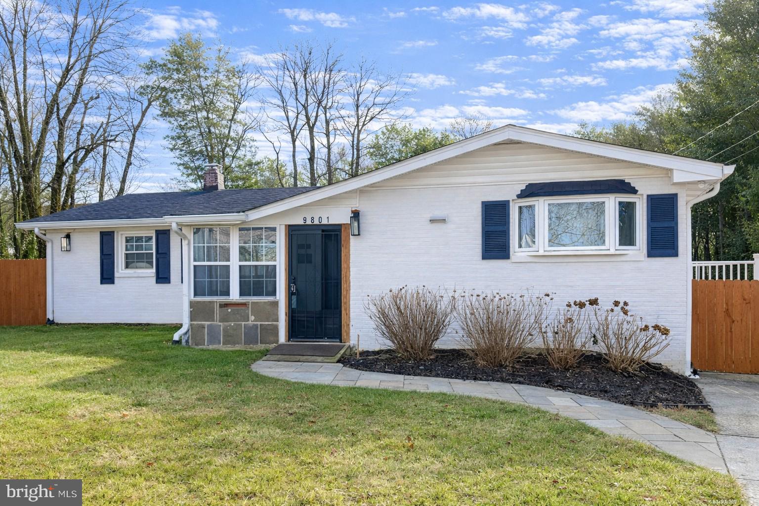 9801 Belhaven Road Bethesda, MD 20817 - Photo 1 of 32 a front view of a house with a yard