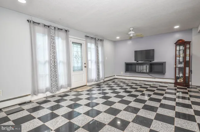 a large white checkered floor with a black white checkered floor