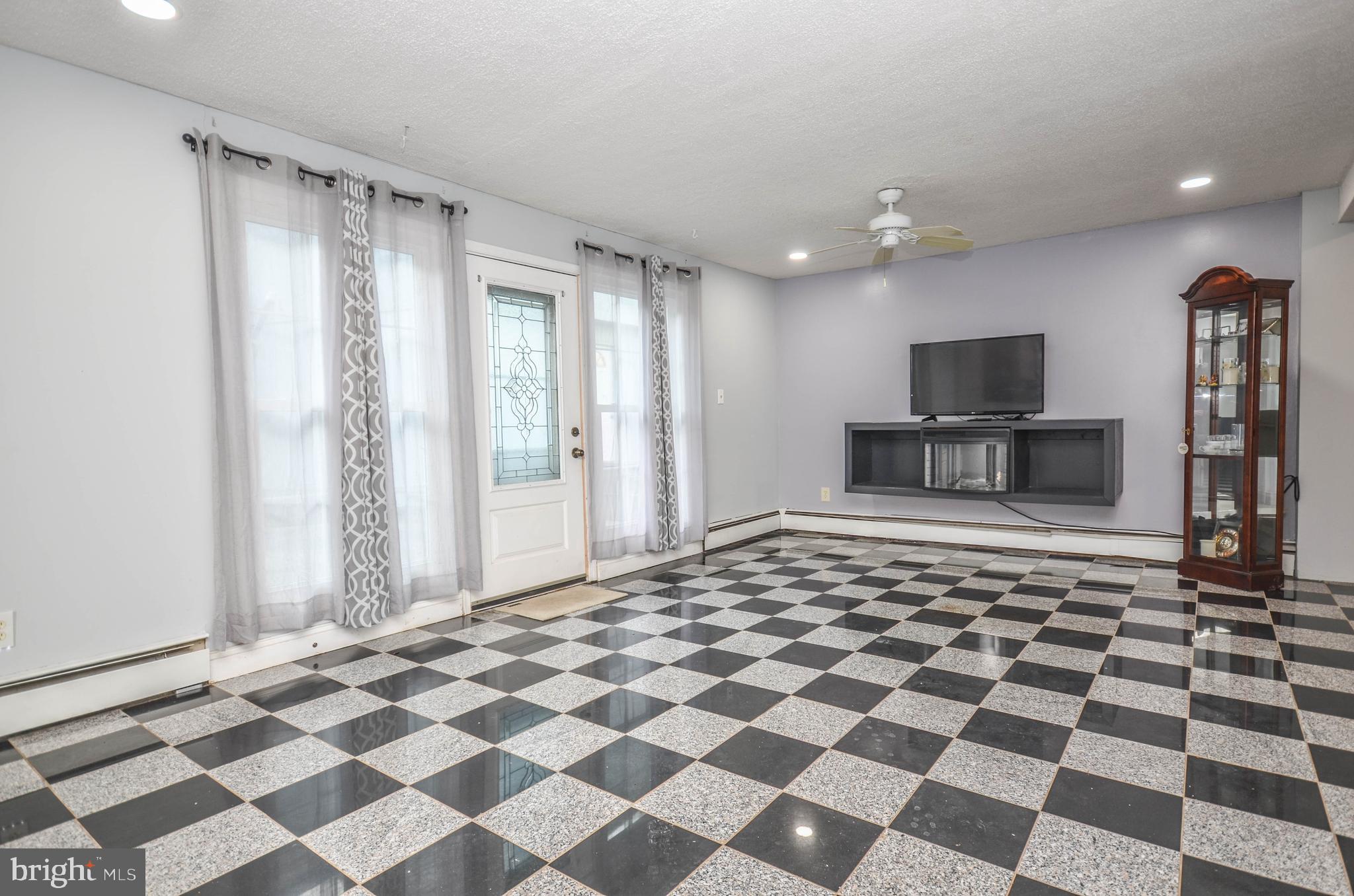 9801 Belhaven Road Bethesda, MD 20817 - Photo 21 of 32 a large white checkered floor with a black white checkered floor