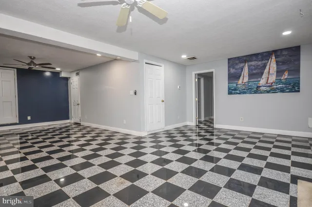 a room with a black white checkered floor