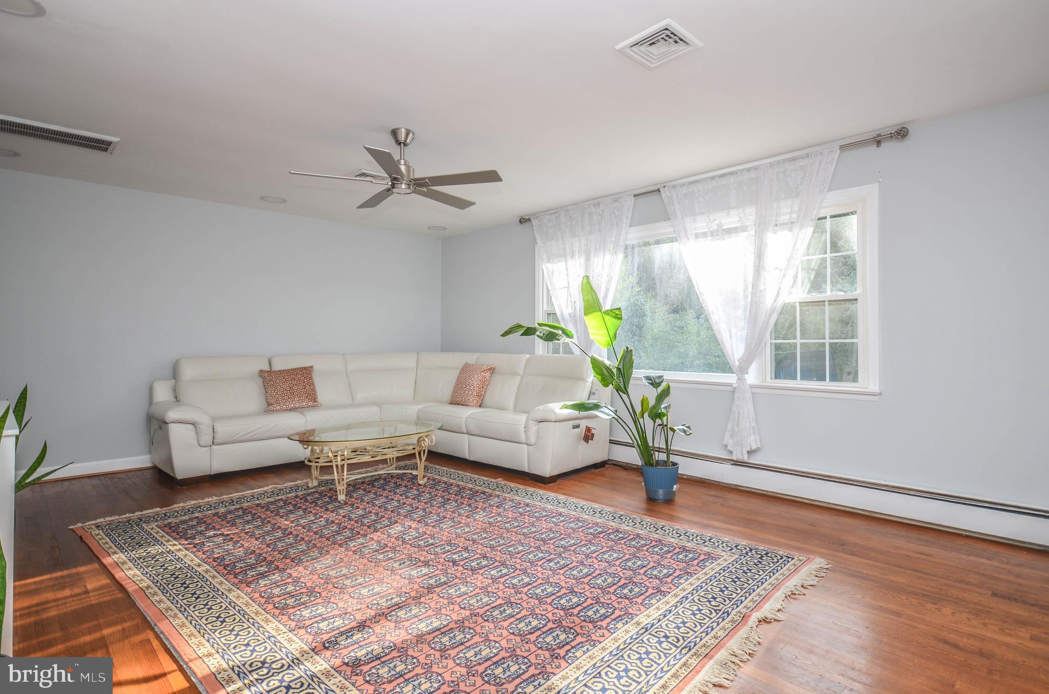 9801 Belhaven Road Bethesda, MD 20817 - Photo 3 of 32 a living room with furniture and a rug