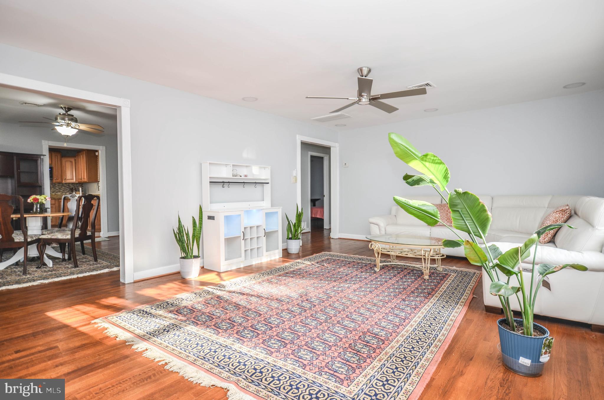 9801 Belhaven Road Bethesda, MD 20817 - Photo 4 of 32 a living room filled with furniture and a table