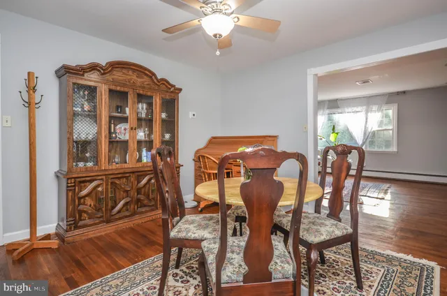 a view of a dining room with furniture and chandelier