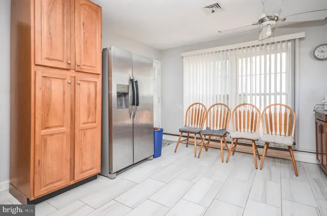 a view of a livingroom with furniture and a window