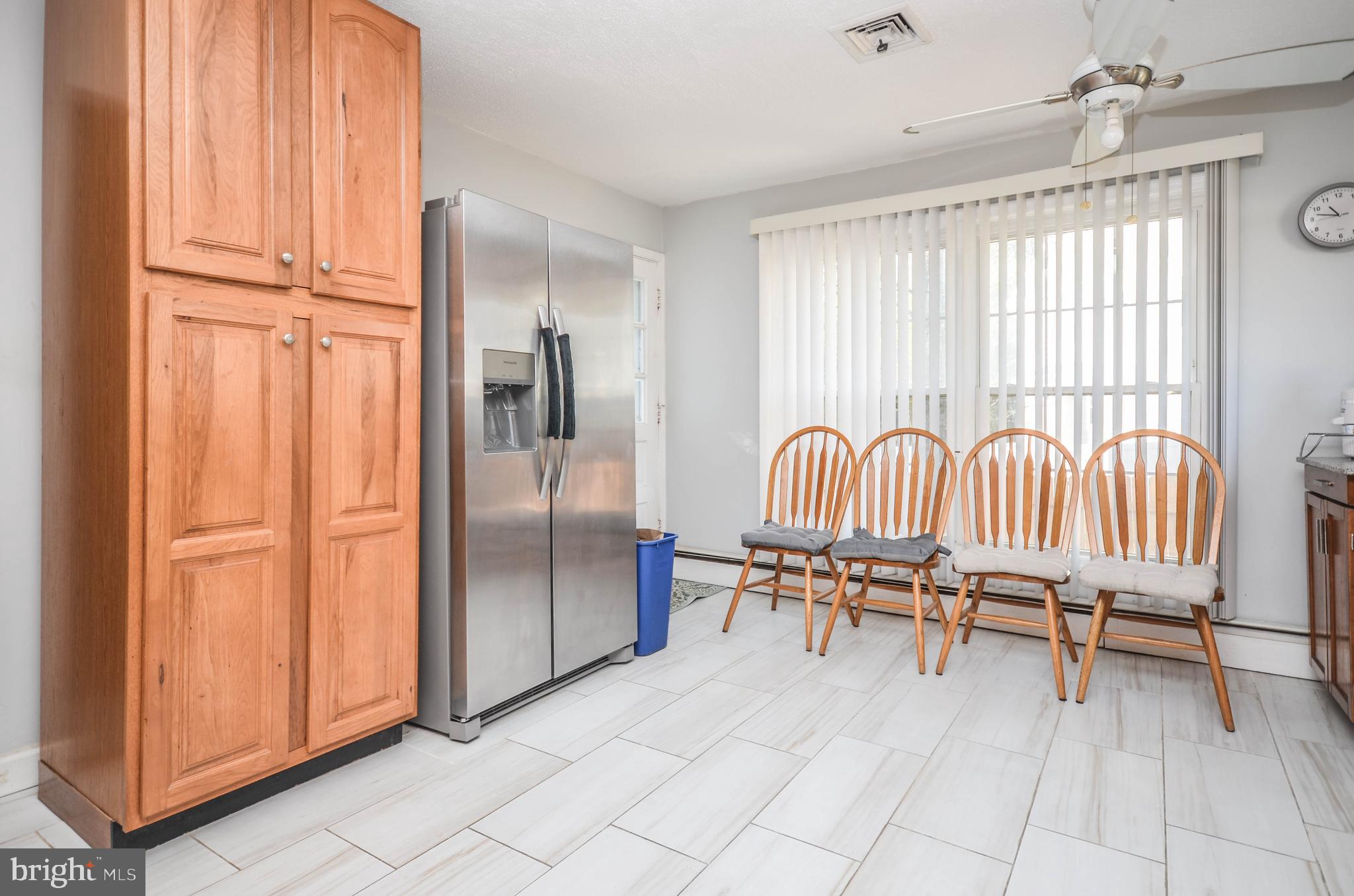 9801 Belhaven Road Bethesda, MD 20817 - Photo 10 of 32 a view of a livingroom with furniture and a window