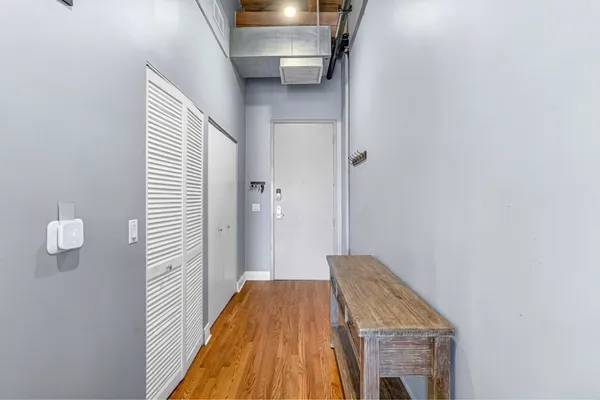 a view of a hallway with front door