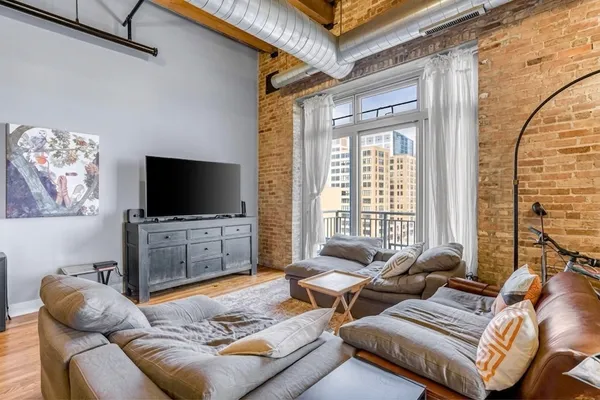 a living room with furniture and a flat screen tv