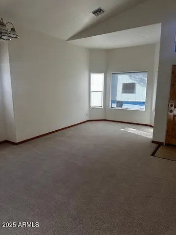 a view of a room that has a window