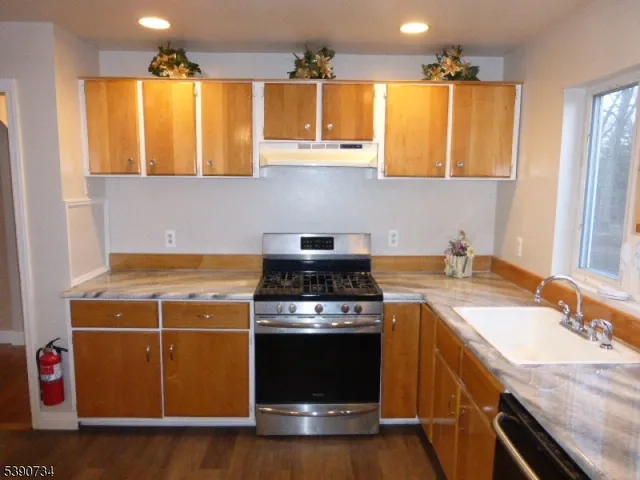 a kitchen with a stove and a sink