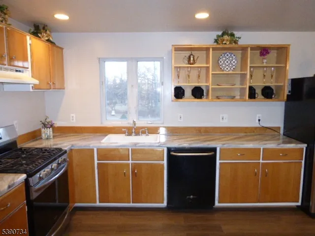 a kitchen with a stove and a sink