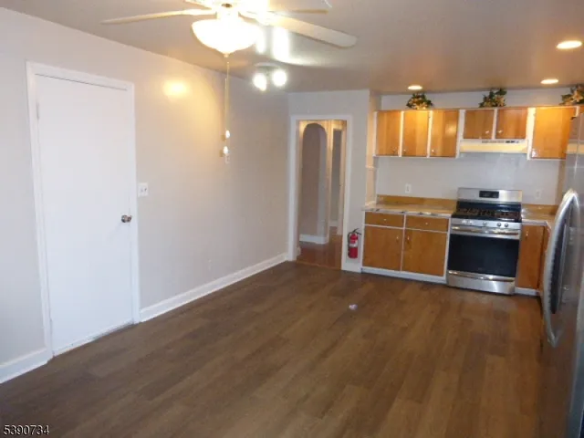 a view of a kitchen with wooden floor