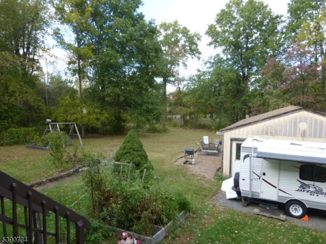 a house view with a garden space