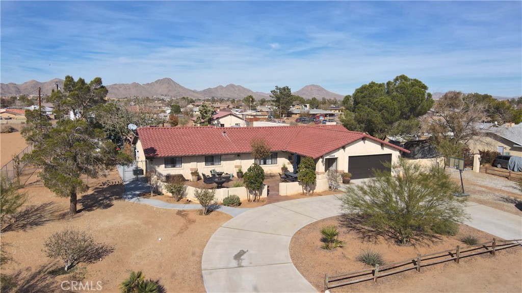 14720 Erie Road Apple Valley, CA 92307 - Photo 1 of 1 a view of a house with a yard