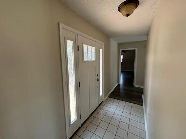 a view of an empty room with windows