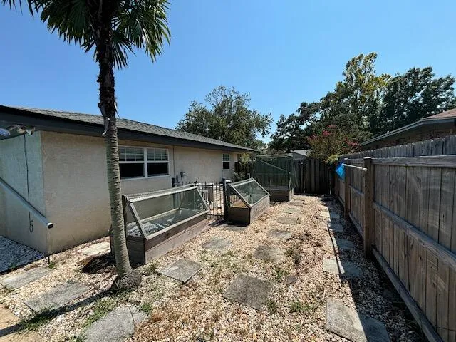a view of backyard with a trees