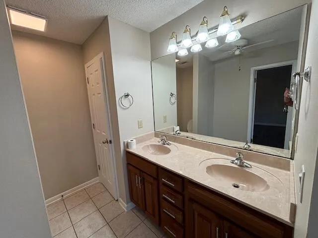 a bathroom with a sink double vanity and a mirror