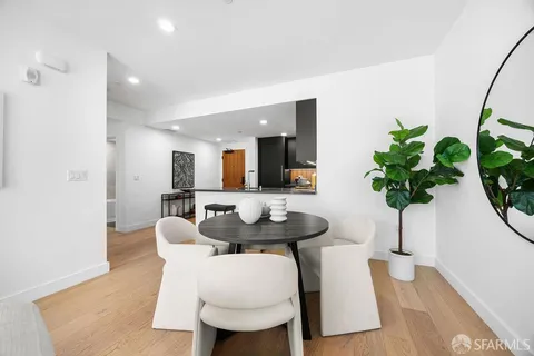 a kitchen with stainless steel appliances granite countertop a refrigerator and a stove