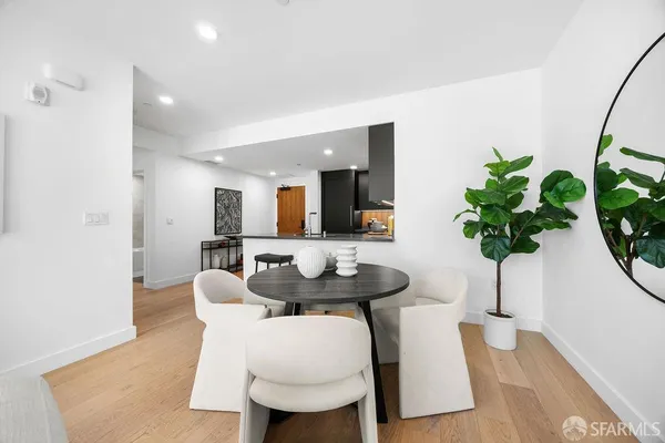 a kitchen with stainless steel appliances granite countertop a refrigerator and a stove