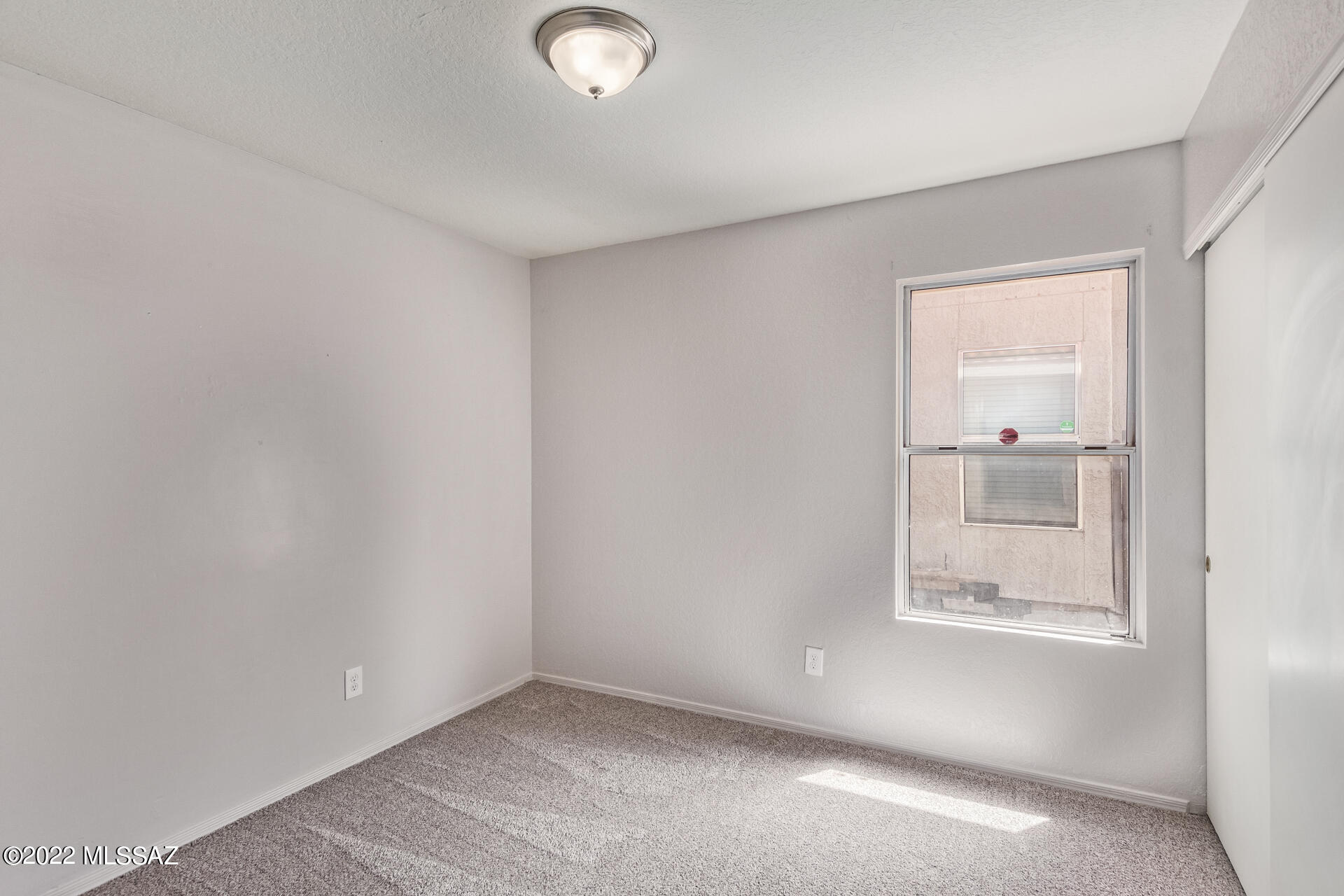 4697 West Weathervane Street Tucson, AZ 85741 - Photo 18 of 25 an empty room with a window