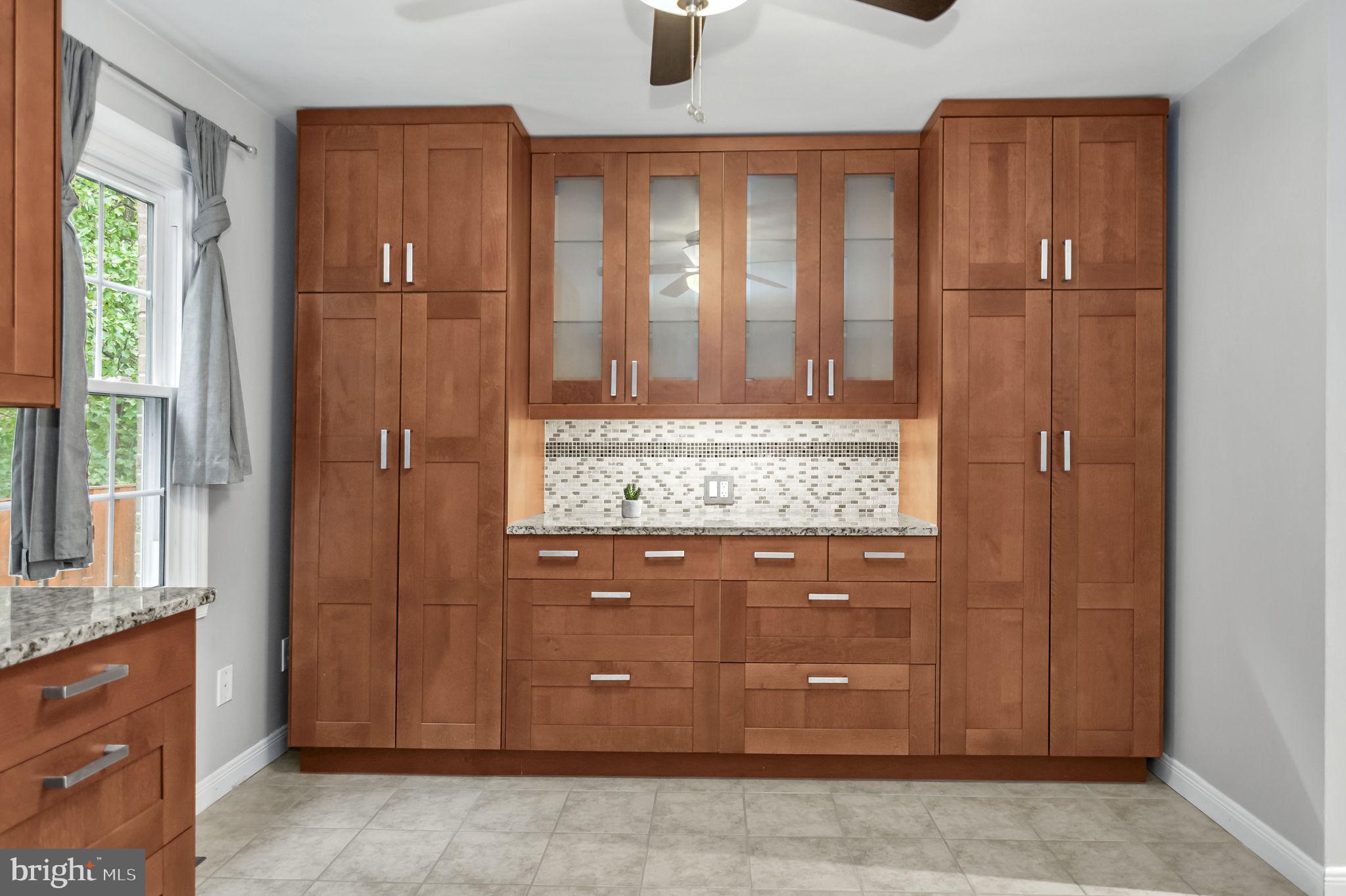 8914 Grandstaff Court Springfield, VA 22153 - Photo 12 of 48 a bathroom with a granite countertop sink and a mirror