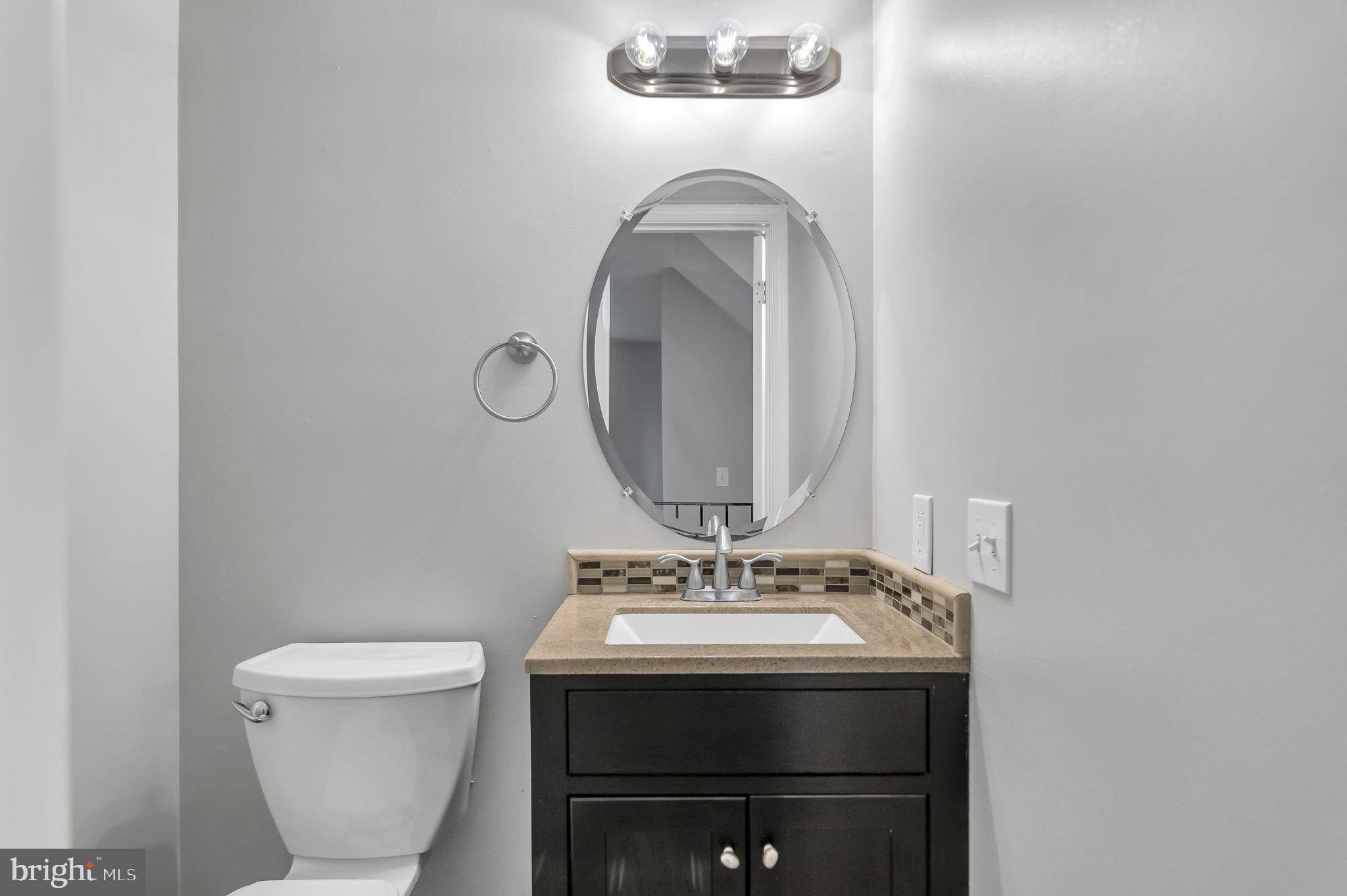 8914 Grandstaff Court Springfield, VA 22153 - Photo 14 of 48 a bathroom with a sink and a mirror