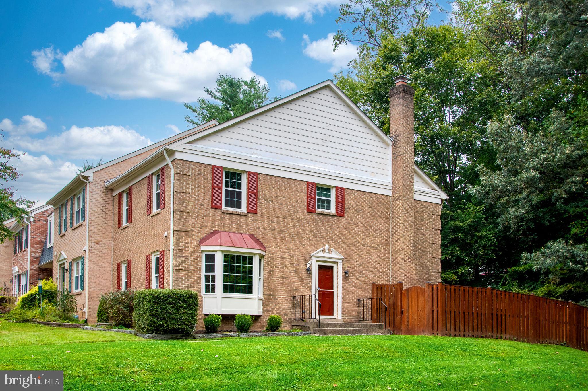 8914 Grandstaff Court Springfield, VA 22153 - Photo 2 of 48 a view of a yard in front of a house with plants and large tree