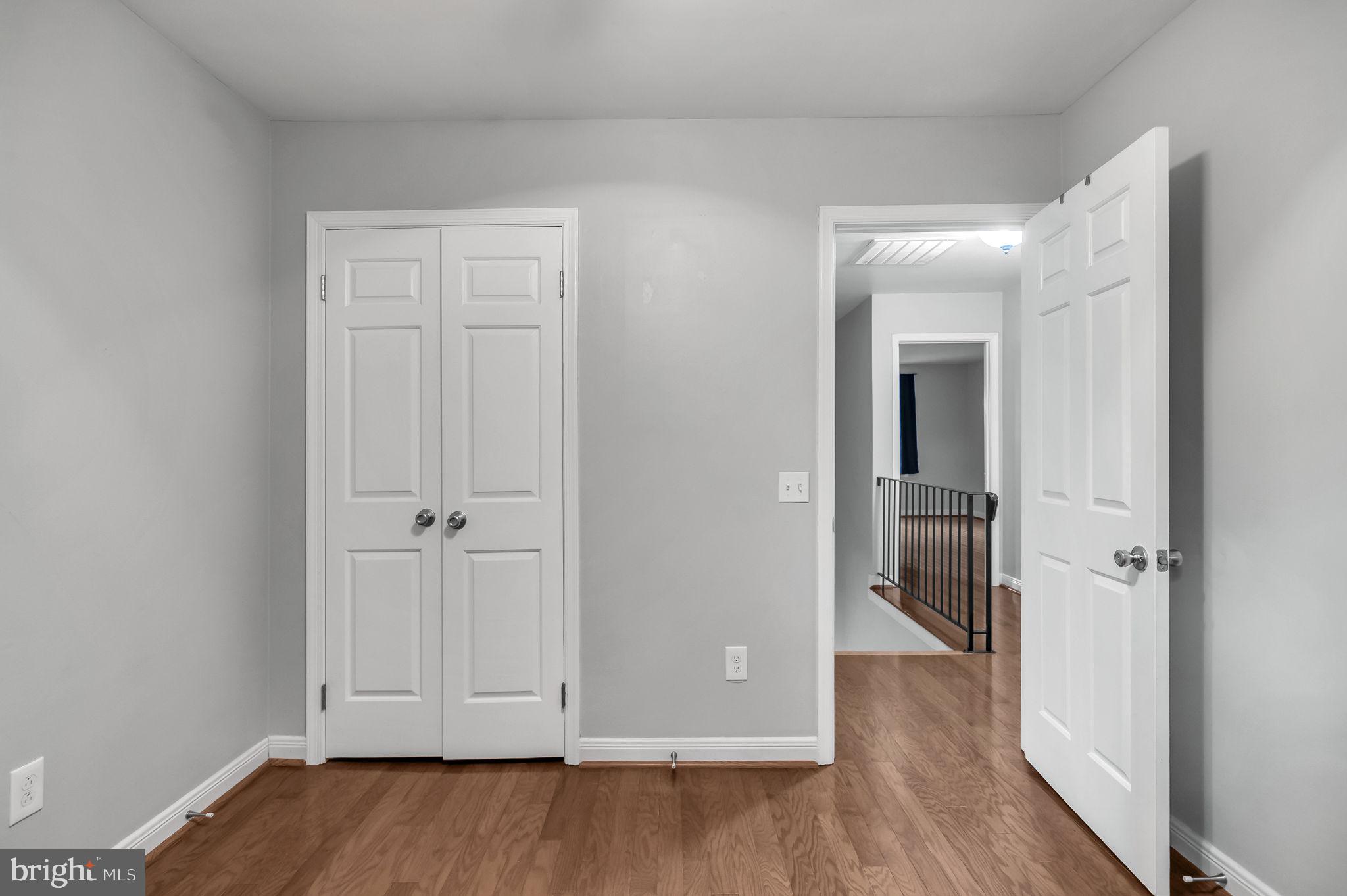 8914 Grandstaff Court Springfield, VA 22153 - Photo 25 of 48 a view of a hallway with wooden floor