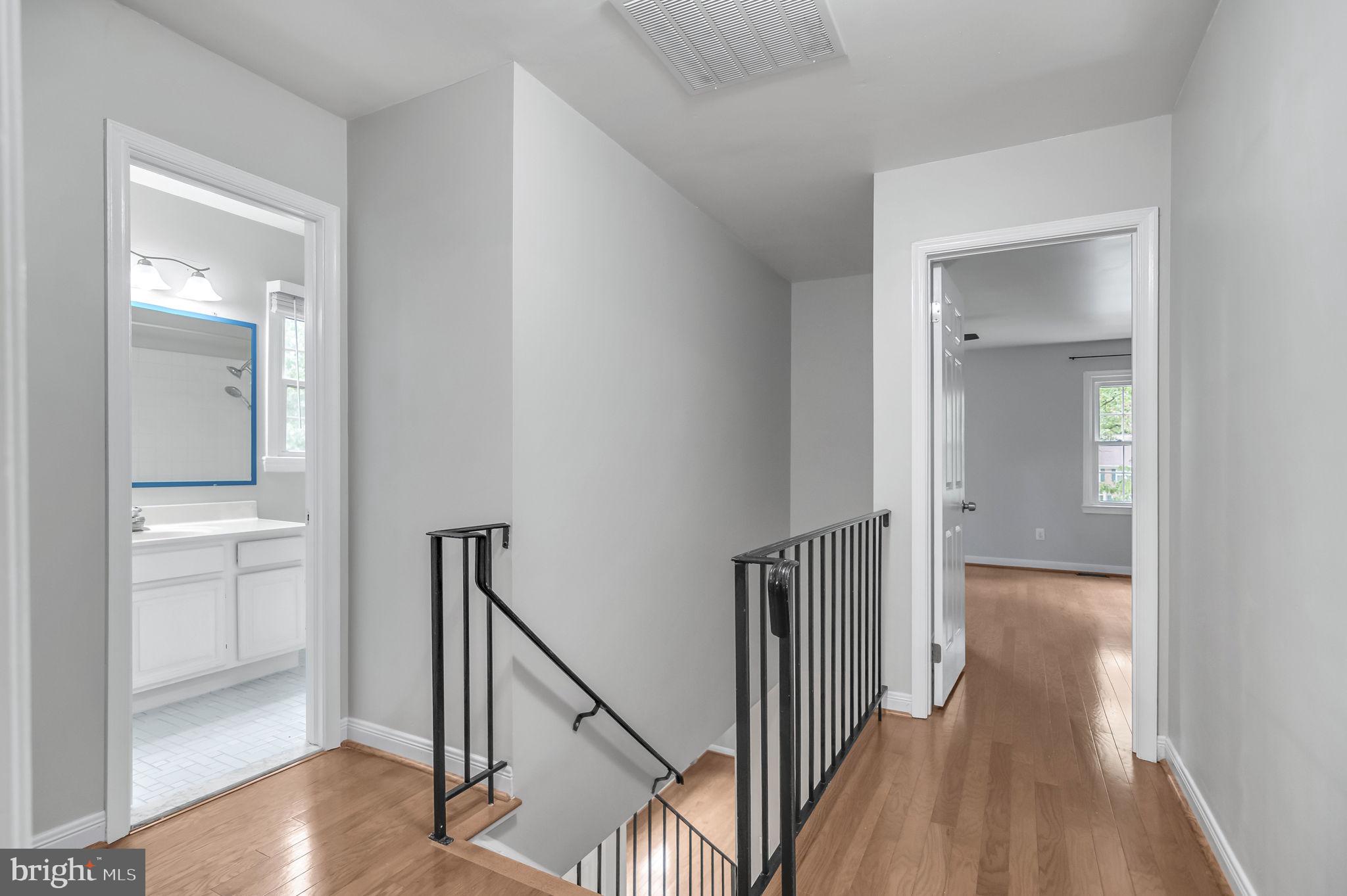 8914 Grandstaff Court Springfield, VA 22153 - Photo 29 of 48 a view of a hallway with wooden floor and entryway