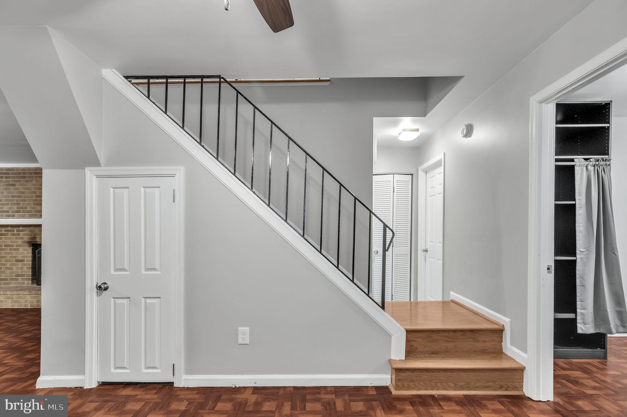 8914 Grandstaff Court Springfield, VA 22153 - Photo 30 of 48 a view of staircase with lots of frames and a rug