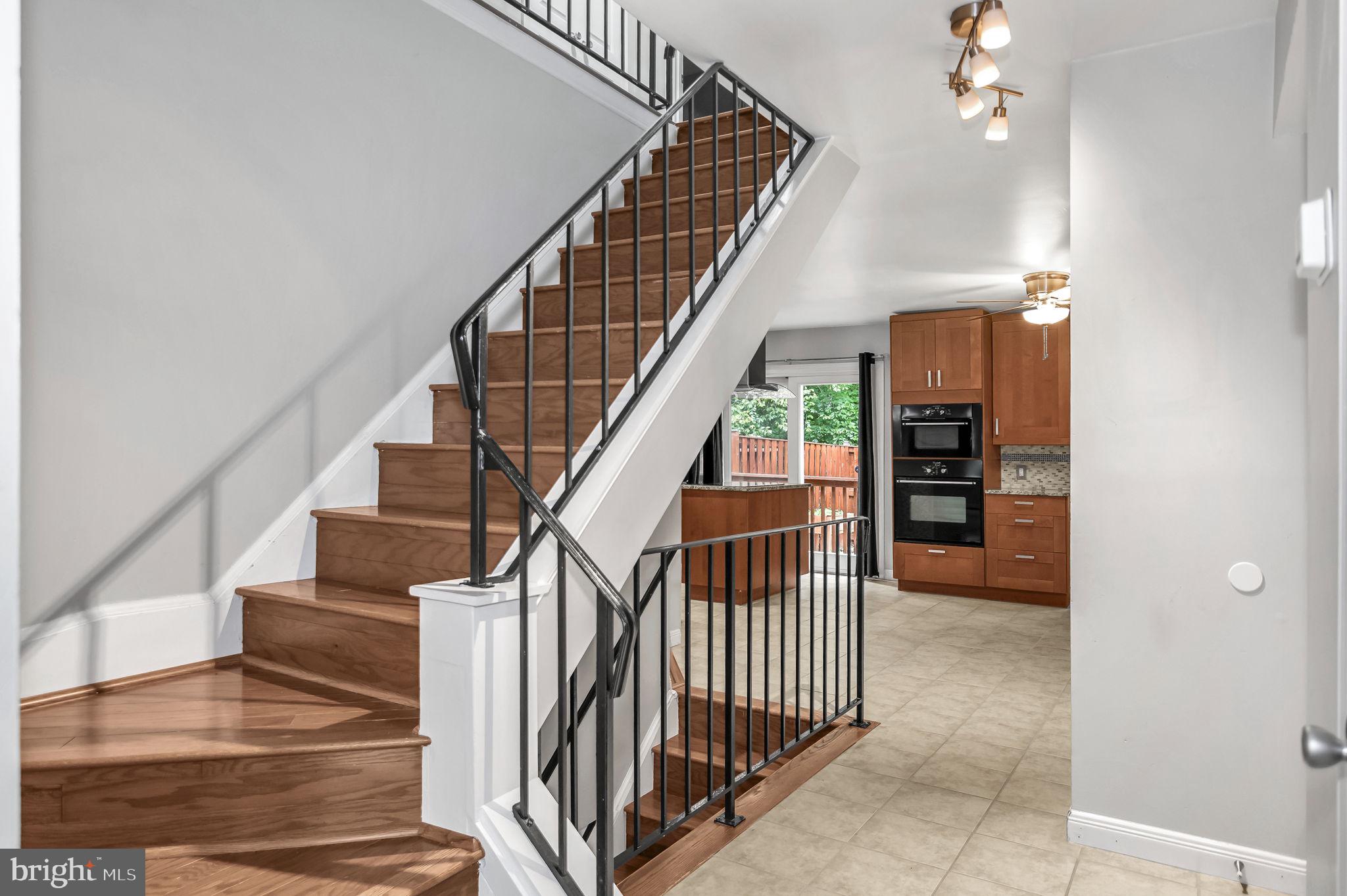 8914 Grandstaff Court Springfield, VA 22153 - Photo 3 of 48 a view of entryway and hall with wooden floor