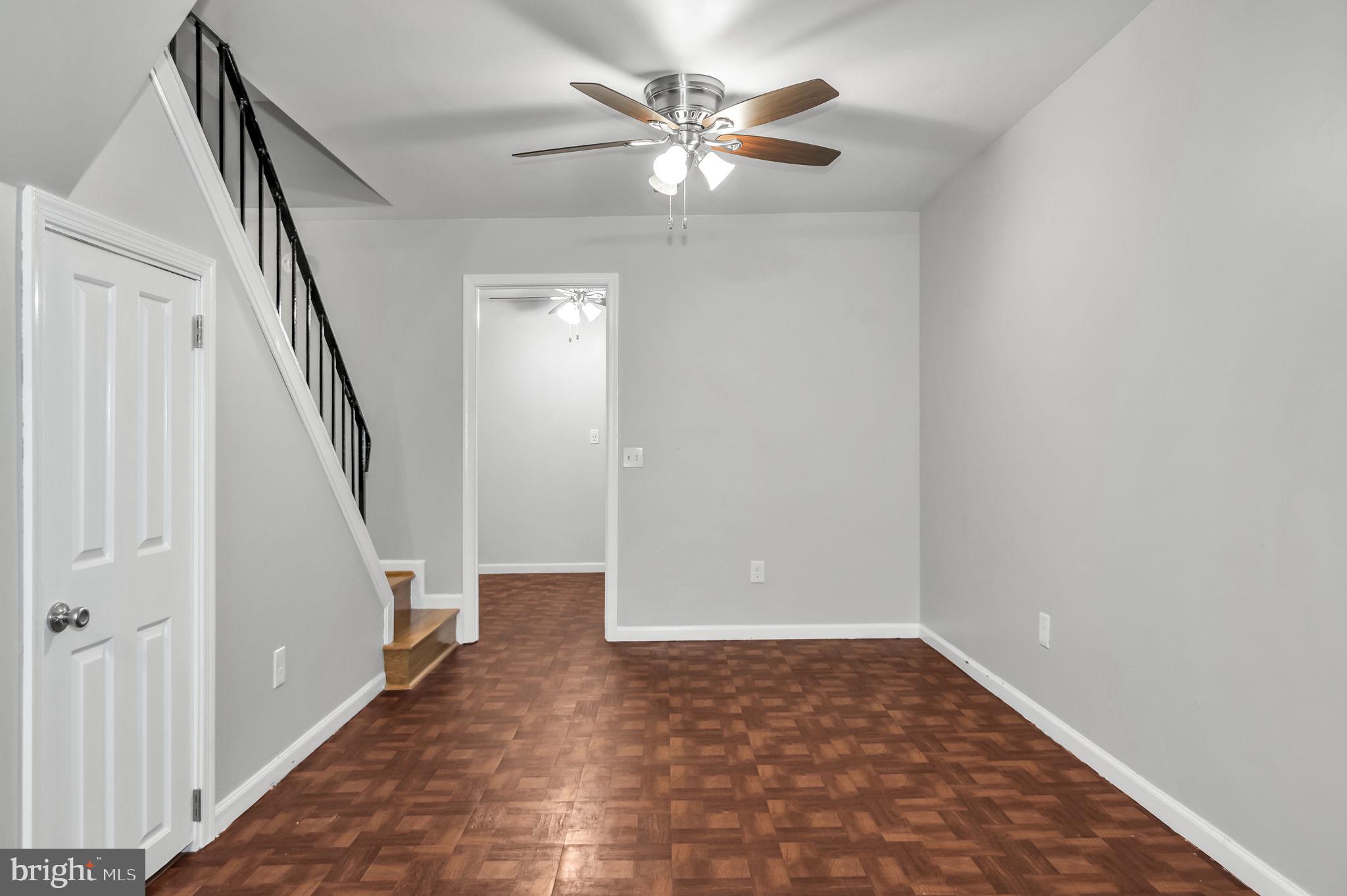 8914 Grandstaff Court Springfield, VA 22153 - Photo 31 of 48 a view of an empty room with stairs and a ceiling fan