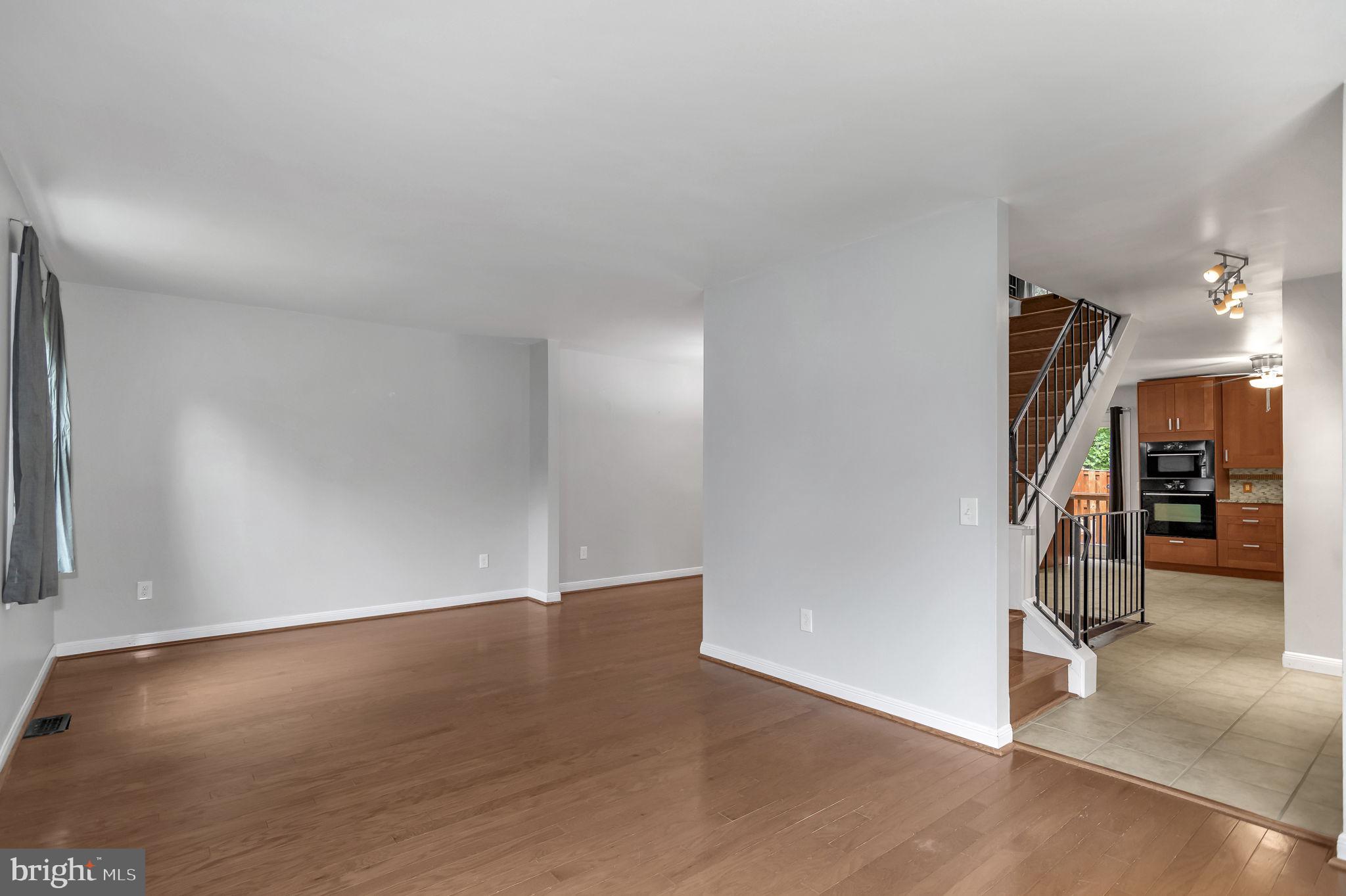 8914 Grandstaff Court Springfield, VA 22153 - Photo 4 of 48 a view of a livingroom with wooden floor