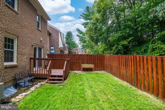 a view of backyard with a small cabin and furniture
