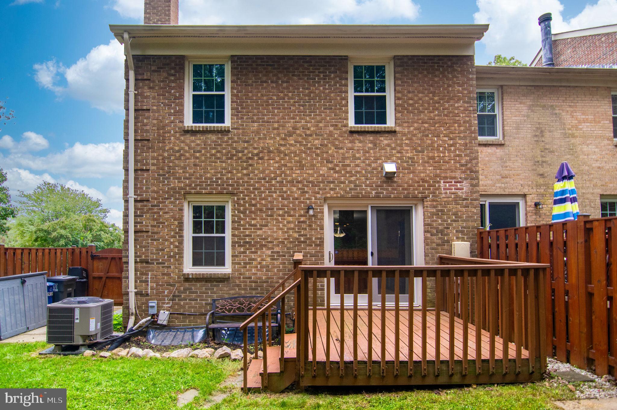 8914 Grandstaff Court Springfield, VA 22153 - Photo 44 of 48 a front view of a house with a garden