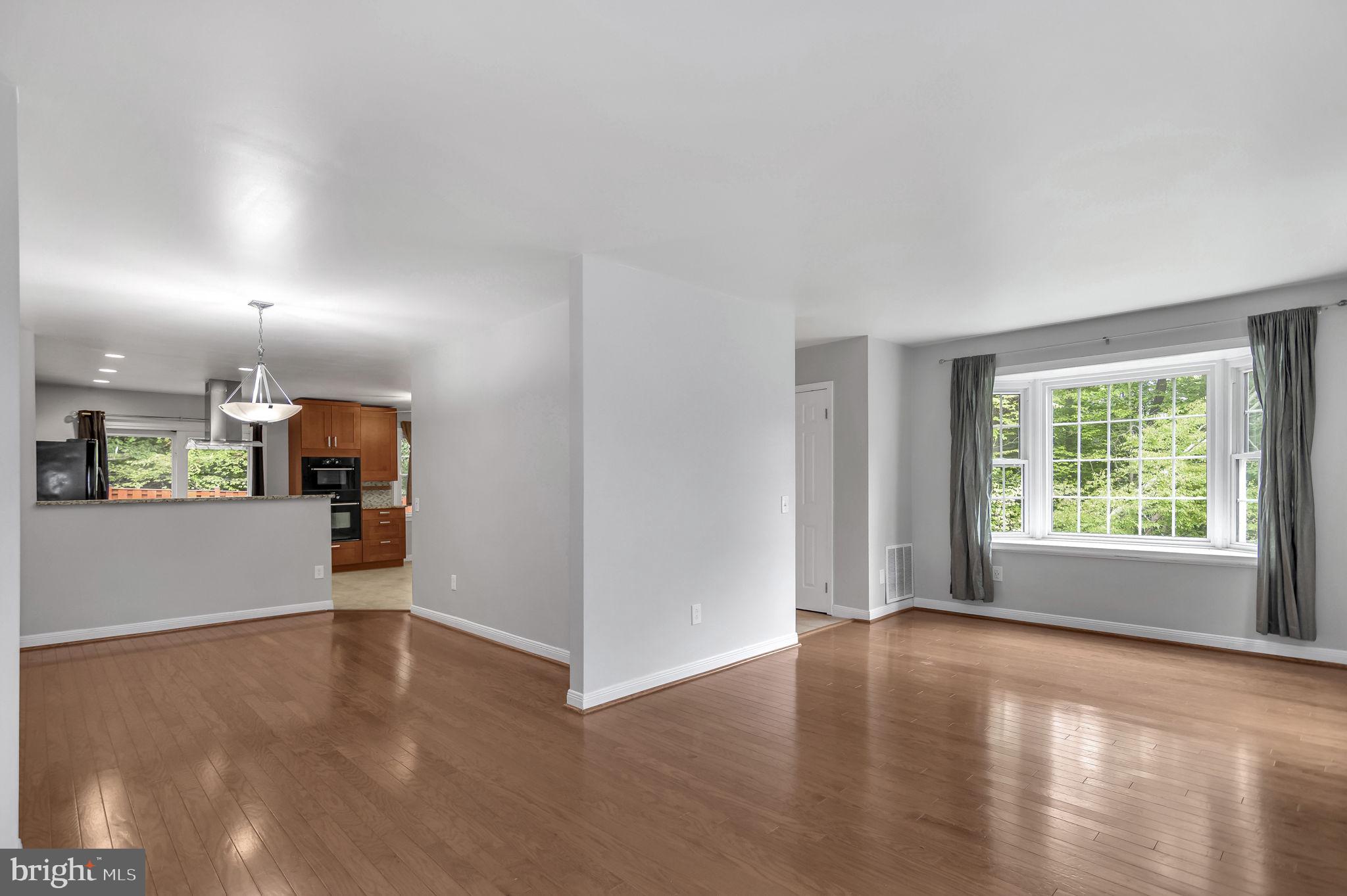 8914 Grandstaff Court Springfield, VA 22153 - Photo 5 of 48 an empty room with wooden floor and windows