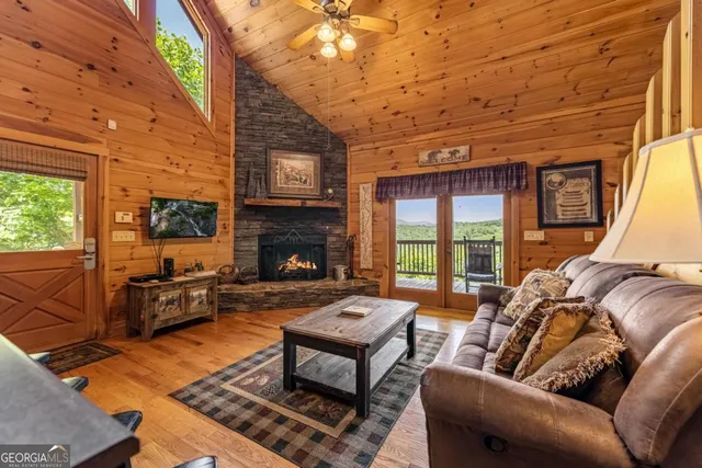 a view of a porch with wooden floor and furniture