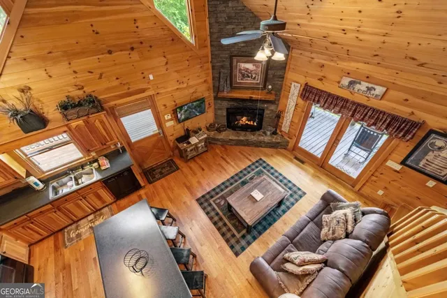 a view of a livingroom with furniture and a window