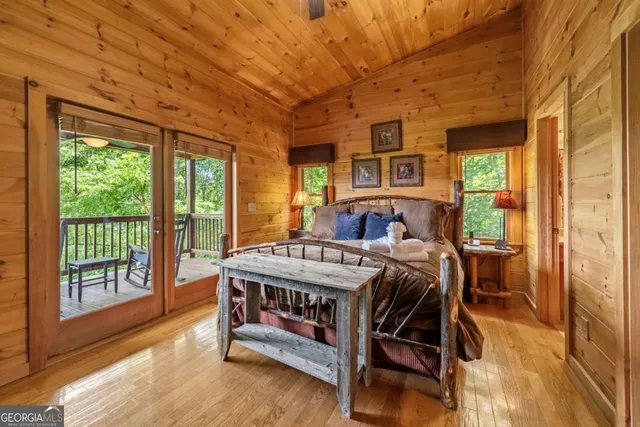 a bedroom with furniture and a window