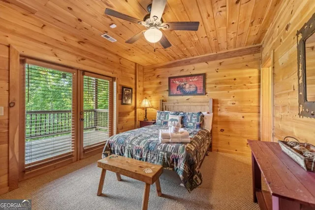 a view of a roof deck with wooden floor and fence