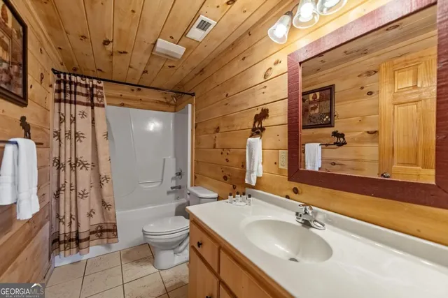 a view of a mountain in the distance in a field