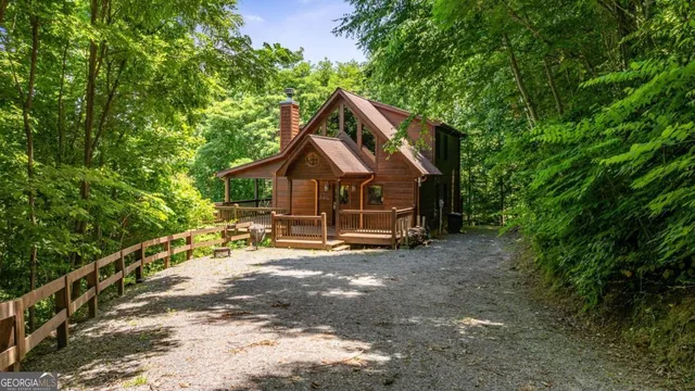 a kitchen with stainless steel appliances kitchen island granite countertop a sink and cabinets