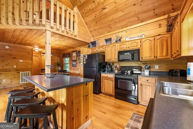 a outdoor space with patio furniture and a fireplace